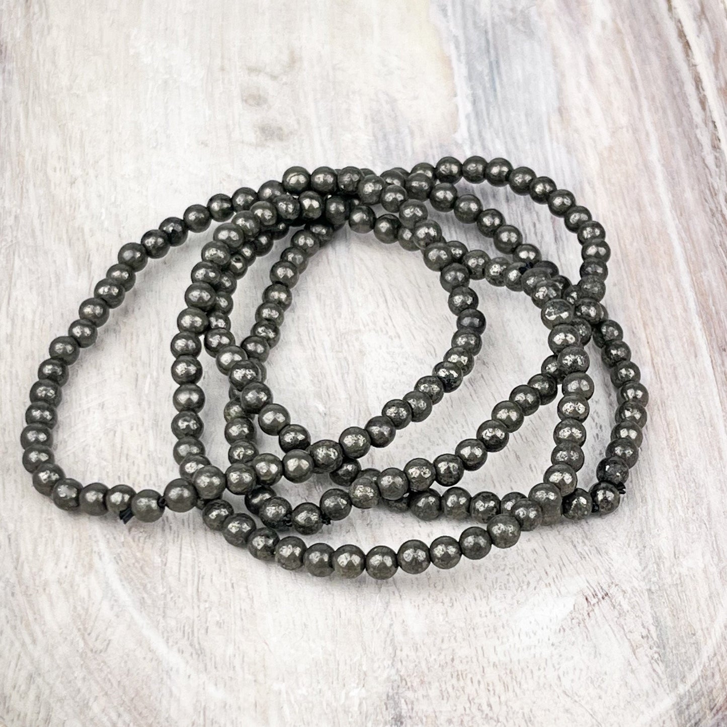 Pyrite Gemstone Bracelet: Protection Stone for New Beginnings and Prosperity - 4mm Beads - 7.5 Inches - Crystals for everyone • Crystals And Cord