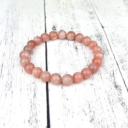 Emotional Healing Peach Moonstone Bracelet – 8mm Natural Gemstone Beads on Stretch Cord for Self-Love, Soothing Energy & Inner Balance - Crystals for everyone • Crystals And Cord